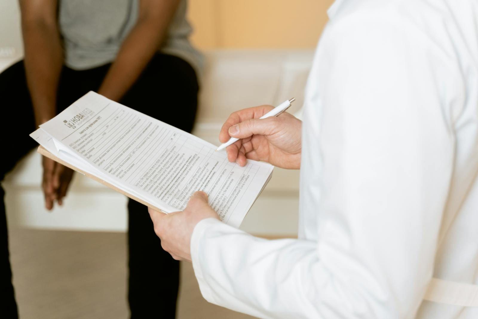 A GP talking with a patient in a consultation